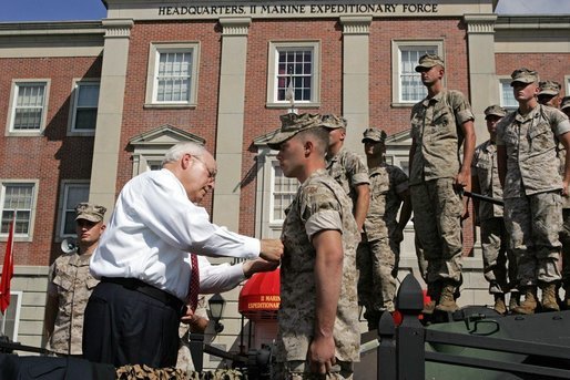 Vice President Dick Cheney pins the Purple Heart Medal onto U.S. Marine CPL Daniel Foot during a rally at Camp Lejeune in Jacksonville, NC, Monday, October 3, 2005. The Vice President presented five Marines with medal at that time. White House photo by David Bohrer