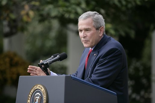 President George W. Bush responds to a question during Tuesday's news conference in the Rose Garden of the White House. White House photo by Eric Draper