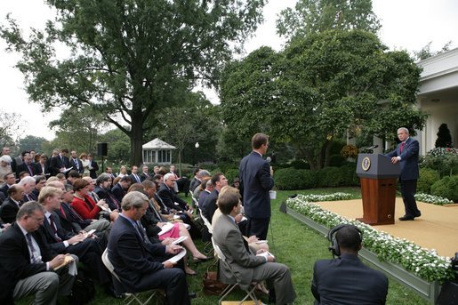President George W. Bush listens to a question from the media Tuesday, Oct. 4, 2005, during a news conference in the Rose Garden. Before taking questions, the President spoke briefly on his Supreme Court nomination of Harriet Miers and the continuing cleanup and reconstruction effort in the wake of hurricanes Katrina and Rita. White House photo by Eric Draper