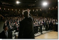 President George W. Bush waves and acknowledges the applause of the audience, following his remarks on the War on Terror, Thursday, Oct. 6, 2005, speaking before the National Endowment for Democracy at the Ronald Reagan Building and International Trade Center in Washington.  White House photo by Eric Draper