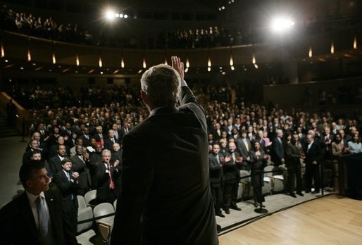 President George W. Bush waves and acknowledges the applause of the audience, following his remarks on the War on Terror, Thursday, Oct. 6, 2005, speaking before the National Endowment for Democracy at the Ronald Reagan Building and International Trade Center in Washington. White House photo by Eric Draper
