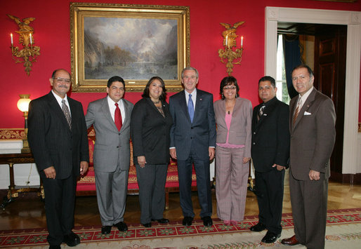 President George W. Bush poses for a photo in the Red Room of the White House, Friday, Oct. 7, 2005, with recipients of the President's Volunteer Service Awards, honored in celebration of Hispanic Heritage Month. From left to right with President Bush are John Diaz of Crowley, Colo., Manuel Fonseca of Nashville, Tenn., Marie Arcos of Houston Texas, Maria Hines of Albuquerque, N.M., Eleuterio "Junior" Salazar of Bradenton, Fla. and Dr. Elmer Carreno of Silver Spring, Md. White House photo by Shealah Craighead
