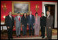 President George W. Bush poses for a photo in the Red Room of the White House, Friday, Oct. 7, 2005, with recipients of the President's Volunteer Service Awards, honored in celebration of Hispanic Heritage Month. From left to right with President Bush are John Diaz of Crowley, Colo., Manuel Fonseca of Nashville, Tenn., Marie Arcos of Houston Texas, Maria Hines of Albuquerque, N.M., Eleuterio "Junior" Salazar of Bradenton, Fla. and Dr. Elmer Carreno of Silver Spring, Md. White House photo by Shealah Craighead