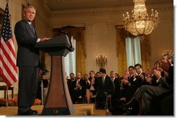 President George W. Bush is applauded in the East Room of the White House, Friday, Oct. 7, 2005, as he offers remarks in celebration of Hispanic Heritage Month. President Bush also honored recipients of the President's Volunteer Service Awards at the event.  White House photo by Shealah Craighead
