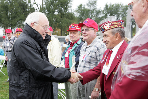 Vice President Dick Cheney shakes hands with veterans of the 526th Armored Infantry Battalion Friday, Oct. 7, 2005, after delivering remarks during a wreath-laying ceremony at the National World War II Memorial in Washington D.C. "I count it a privilege to stand in the presence of men who were sent into battle by President Franklin D. Roosevelt.and who, by your courage and honor and devotion to duty, helped to win a war and change the course of history ," said the Vice President to the soldiers, widows and family members who attended the ceremony. The 526th AIB is the sole remaining, separate, armored infantry battalion from World War II whose soldiers defended the Belgian villages of Stavelot and Malmedy on December 16, 1944, the first day of the Battle of the Bulge. White House photo by David Bohrer