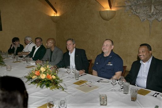 President George W. Bush, center, is seen Monday evening, Oct. 10, 2005 at the restaurant Bacco in New Orleans, La., sitting next to U. S. Coast Guard Vice Admiral Thad W. Allen, New Orleans Mayor Ray Nagin and joined by other local officials. White House photo by Eric Draper