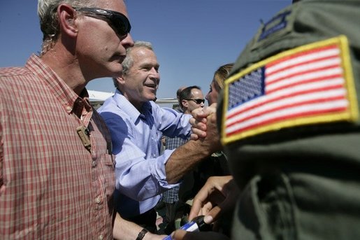 President George W. Bush greets staff personnel at the U.S. Naval Air Station, Joint Reserve Base, Tuesday, Oct. 11, 2005 in New Orleans. White House photo by Eric Draper