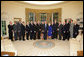 President George W. Bush poses in the Oval Office with recipients of the Secretary of Defense Employer Support Freedom Award, Friday, Oct. 14, 2005 at the White House in Washington. The award is recognition for providing exceptional support to their National Guard and Reserve employees. White House photo by Paul Morse
