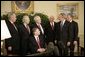 President George W. Bush meets with former justices of the Texas Supreme Court Monday, Oct. 17, 2005, in the Oval Office of the White House. From left are: Former Associate Justice Eugene Cook; former Associate Justice Raul Gonzalez; Texas Attorney General and former Associate Justice Greg Abbott, seated; former Texas Chief Justice John Hill; former Associate Justice James Baker; the President, and former Associate Justice Craig Enoch. White House photo by Eric Draper