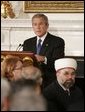 President George W. Bush welcomes guests to the Iftaar Dinner with Ambassadors and Muslim Leaders, held in the State Dining Room of the White House, Monday, Oct. 17, 2005 in Washington. White House photo by Paul Morse