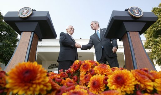 President George W. Bush and President Mahmoud Abbas, of the Palestinian Authority, shake hands after speaking with the media Thursday, Oct. 20, 2005, in the Rose Garden of the White House. White House photo by Paul Morse