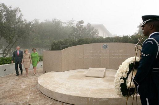President George W. Bush, Nancy Reagan and Laura Bush approach the memorial of President Ronald Reagan at the Ronald Reagan Presidential Library in Simi Valley, Calif., where they participated in a wreath laying ceremony, Friday, Oct. 21, 2005. White House photo by Eric Draper