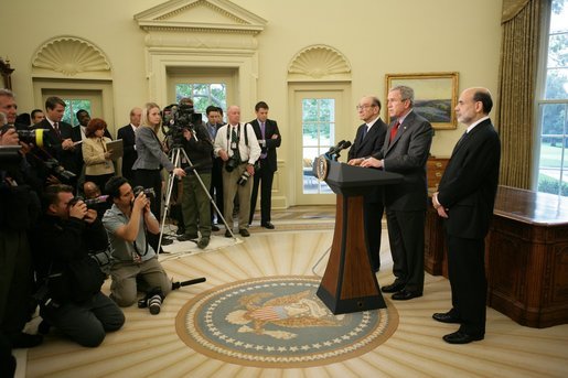 President George W. Bush is joined by Alan Greenspan, left, Chairman of the Federal Reserve, as he announces his nomination Monday, Oct. 24, 2005, of Ben Bernanke, right, as the new Chairman, to replace Mr. Greenspan when he retires in January. Said the President, "Ben Bernanke is the right man to build on the record Alan Greenspan has established. White House photo by Paul Morse