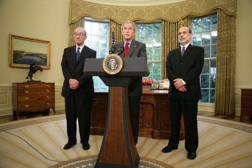 President George W. Bush announces his nomination of Ben Bernanke, right, to replace Alan Greenspan, left, as Chairman of the Federal Reserve when Mr. Greenspan's term expires in January. The announcement was made Monday, Oct. 24, 2005, in the Oval Office. White House photo by Paul Morse