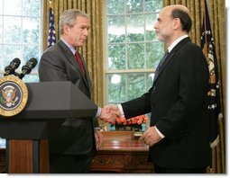 President George W. Bush shakes the hand of Ben Bernanke after announcing his decision to nominate Mr. Bernanke as Chairman of the Federal Reserve, replacing Alan Greenspan upon his retirement in January 2006. The announcement came Monday, Oct. 24, 2005, in the Oval Office.  White House photo by Paul Morse