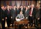 President George W. Bush is joined by legislators, Wednesday, Oct. 26, 2005 at the Eisenhower Executive Office Building in Washington, as he signs the Protection of Lawful Commerce in Arms Act. White House photo by Paul Morse
