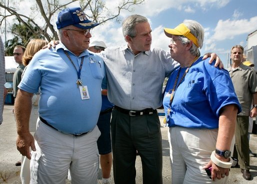 President George W. Bush greets Tennessee Southern Baptist Convention volunteers while visiting a food and distribution center, Thursday, Oct. 27, 2005, in the hurricane damaged area of Pompano Beach, Fla. White House photo by Eric Draper