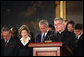 President George W. Bush and Laura Bush participate in a prayer led by Reverend Daniel Coughlin, House Chaplain, in honor of Rosa Parks during a wreath-laying ceremony in the Rotunda of the U.S. Capitol in Washington, D.C., Sunday Oct. 30, 2005. Rosa Parks passed away Monday, Oct. 24th. White House photo by Shealah Craighead