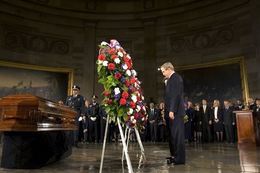 President George W. Bush and Laura Bush present the Executive Branch Wreath during a wreath-laying ceremony in honor of Rosa Parks, in the Rotunda of the U.S. Capitol in Washington, D.C., Sunday Oct. 30, 2005. White House photo by Shealah Craighead