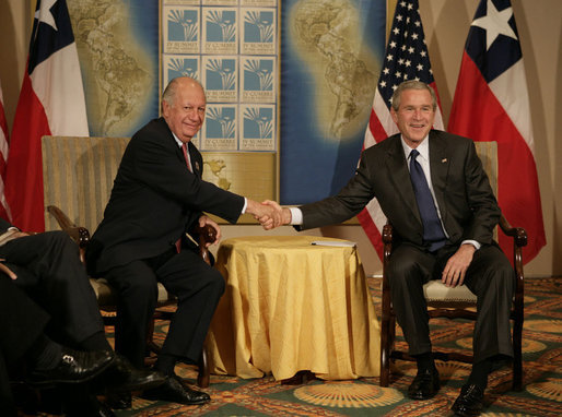 President George W. Bush and Chilean President Ricardo Lago Escobar exchange handshakes Friday, Nov. 4, 2005, during their bilateral meeting at the Sheraton Mar del Plata Hotel in Mar del Plata, Argentina. White House photo by Eric Draper