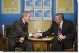 President George W. Bush and President Nestor Carlos Kirchner of Argentina shake hands after their meeting Friday morning, Nov. 4, 2005, at the Hermitage Hotel in Mar del Plata, Argentina. White House photo by Eric Draper