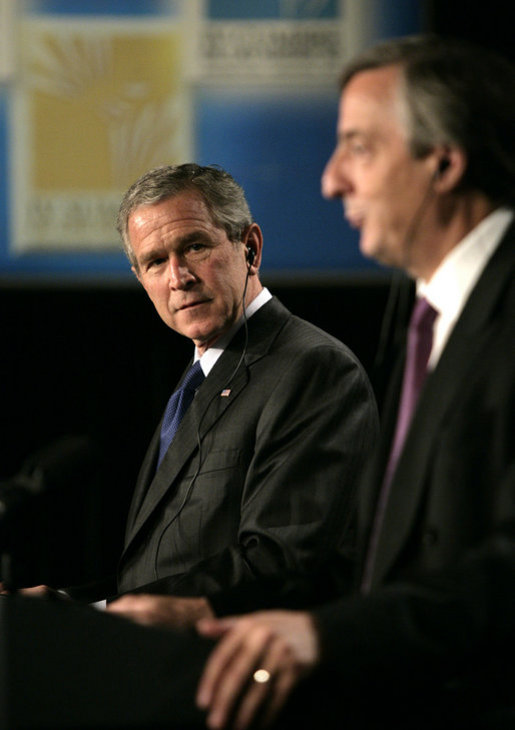 President George W. Bush listens to Argentina's President Nestor Carlos Kirchner as the two hold a joint press availability Friday, Nov. 4, 2005, at the Heritage Hotel in Mar del Plata, Argentina. White House photo by Eric Draper