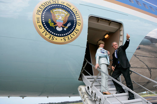President George W. Bush gives the thumbs-up Saturday, November 5, 2005, as he and Mrs. Laura Bush board Air Force One in Mar del Plata after attending the 2005 Summit of the Americas. The President and First Lady traveled to Brasilia where they will spend Sunday visiting with President Luis Inacio Lula Da Silva. White House photo by Eric Draper