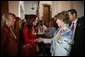 Mrs. Cristina Fernandez de Kirchner welcomes Mrs. Laura Bush to a luncheon Saturday, Nov. 5, 2005, in Mar del Plata, Argentina. The event, hosted by the Argentine First Lady, included a display on Eva Peron and a photo exhibit of important Argentine women depicting their culture. White House photo by Krisanne Johnson