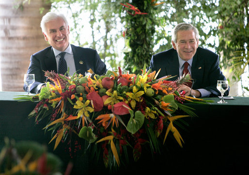 President George W. Bush enjoys a light moment with U.S. Ambassador to Brazil John Danilovich during a roundtable discussion with young leaders from Brazil, Sunday, Nov. 6, 2005 in Brasilia, Brazil. White House photo by Eric Draper