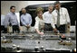 Laura Bush with President George W. Bush turns a knob during a tour of the operations center of the Panama Canal's Miraflores Locks in Panama City, Panama, Monday, Nov. 7, 2005. White House photo by Eric Draper