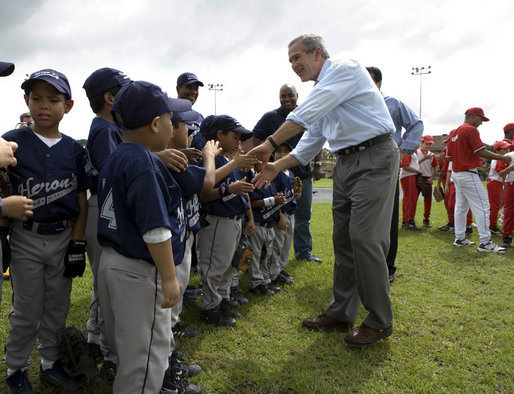 President George W. Bush greets players from the Meron's Academy Little League team in Panama City, Panama, Monday, Nov. 7, 2005. White House photo by Eric Draper