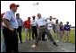 President George W. Bush delivers a pitch from the mound during a baseball event with Major League baseball players and Panamanian youth, Monday, Nov. 7, 2005 in Panama City, Panama. White House photo by Eric Draper