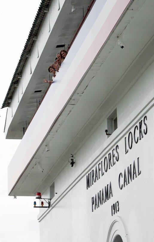 President George W. Bush, Mrs. Laura Bush, Panama's President Martin Torrijos and his wife, Vivian Torrijos, peek out from atop the Miraflores Locks Visitor's Center Monday, Nov. 7, 2005, in Panama City, Panama. White House photo by Paul Morse