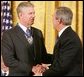 President George W. Bush shakes the hand of Gen. Richard Myers, recently retired Commander of the Joint Chiefs of Staff, after presenting him with the Presidential Medal of Freedom during ceremonies Wednesday, Nov. 9, 2005, at the White House. White House photo by Paul Morse