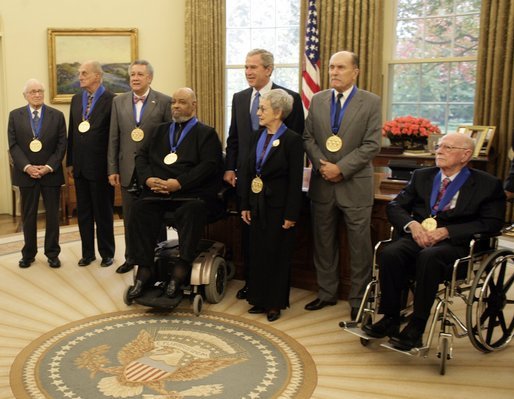 President George W. Bush stands with recipients of the 2005 National Medal of Arts winners Thursday, Nov. 9, 2005, in the Oval Office. Among those recognized for their outstanding contributions to the arts were, from left: Leonard Garment, arts advocate; Louis Auchincloss, author; Paquito D'Rivera, jazzist; James De Preist, symphony conductor; Tina Ramirez, choreographer; Robert Duval, actor, and Ollie Johnston, animator. White House photo by Eric Draper