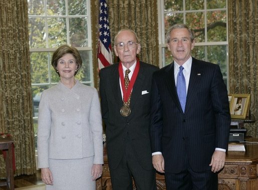 President George W. Bush and Laura Bush stand with 2005 National Humanities Medal recipient Walter Berns, historian, Thursday, Nov. 10, 2005 in the Oval Office at the White House. White House photo by Eric Draper