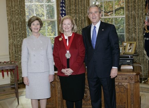 President George W. Bush and Laura Bush stand with 2005 National Humanities Medal recipient Mary Ann Glendon, legal scholar, Thursday, Nov. 10, 2005 in the Oval Office at the White House. White House photo by Eric Draper