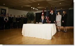 President George W. Bush signs a book of condolence, Thursday, Nov. 10, 2005 at the Embassy of Jordan in Washington, in remembrance of those killed in the terrorist attacks, Wednesday, in Jordan.  White House photo by Eric Draper