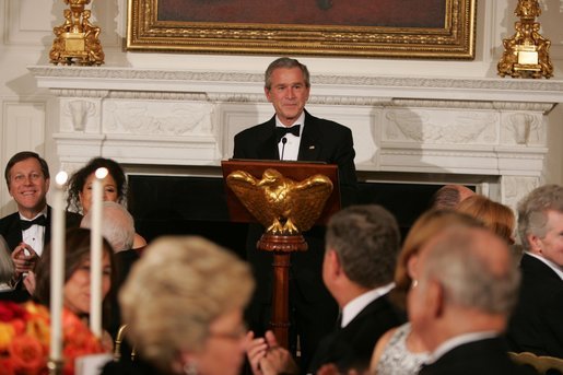 President George W. Bush welcomes guests in the State Dining Room of the White House, Thursday, Nov. 10, 2005, at the dinner celebrating the 40th Anniversary of the National Endowment for the Arts and the National Endowment for the Humanities. White House photo by Paul Morse