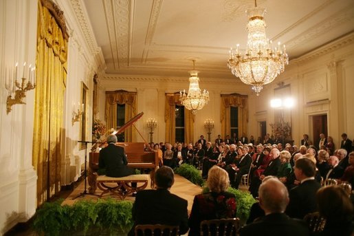 President George W. Bush, Mrs. Laura Bush and guests listen to the evening's entertainment at the White House, Thursday, Nov. 10, 2005, following the dinner celebrating the 40th Anniversary of the National Endowment for the Arts and the National Endowment for the Humanities. White House photo by Paul Morse