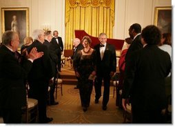 President George W. Bush and Mrs. Laura Bush are applauded at the conclusion of festivities at the White House, Thursday, Nov. 10, 2005, following the evening's celebration of the 40th Anniversary of the National Endowment for the Arts and the National Endowment for the Humanities.  White House photo by Paul Morse