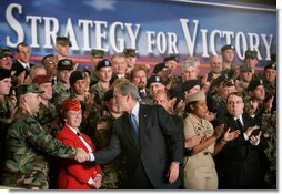 President George W. Bush greets the audience after delivering remarks on the war on terror, Friday, Nov. 11, 2005 at the Tobyhanna Army Depot in Tobyhanna, Pa. White House photo by Eric Draper