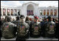 A group of men wearing vests honoring the various branches of the Armed Forces, attend ceremonies Friday, Nov. 11, 2005, during Veterans Day events at Arlington National Cemetery in Arlington, Va. White House photo by David Bohrer