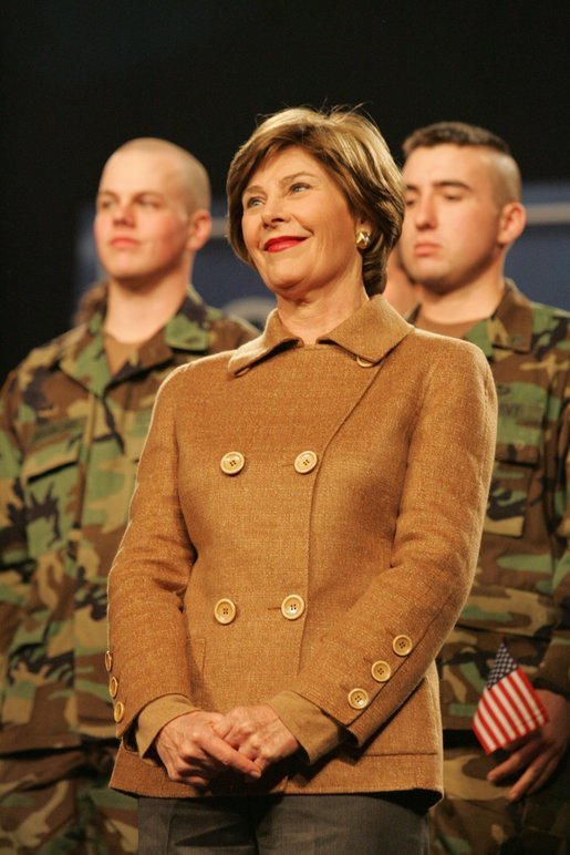 Mrs. Laura Bush smiles as she listens to the President’s introduction Monday, Nov. 14, 2005, at Elmendorf Air Force Base in Anchorage, Alaska, where he delivered remarks on the War on Terror to the troops. White House photo by Shealah Craighead