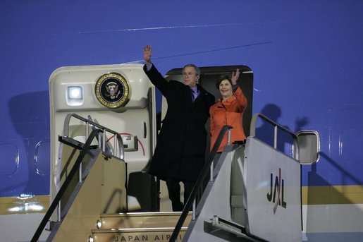 President George W. Bush and Laura Bush wave from Air Force One Tuesday, Nov. 15, 2005, after arriving at Osaka International Airport in Osaka, Japan. White House photo by Paul Morse