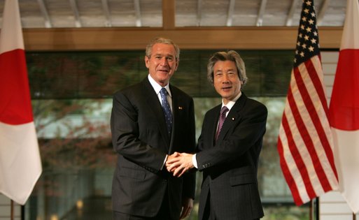 President George W. Bush and Prime Minister Junichiro Koizumi of Japan, shake hands Wednesday, Nov. 16, 2005, prior to their meeting at the Kyoto State Guest House in Kyoto, Japan. White House photo by Paul Morse