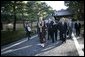 President George W. Bush and Japan’s Prime Minister Junichiro Koizumi join the Reverend Raitei Arima, Chief Priest of the Golden Pavilion Kinkakuji Temple in Kyoto, Japan, Wednesday, Nov. 16, 2005. White House photo by Eric Draper