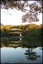 The Golden Pavilion Kinkakuji Temple is reflected in the pool as the sun rises over Kyoto, Japan, Wednesday, Nov. 16, 2005. White House photo by Paul Morse