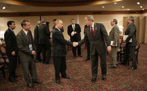 President George W. Bush and Russian President Vladimir Putin exchange handshakes Friday, Nov. 18, 2005, after their meeting in Busan, Korea, prior to the opening of the 2005 APEC conference. White House photo by Eric Draper