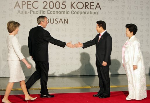President and Mrs. Bush are welcomed by President Moo Hyun Roh of the Republic of Korea, and his wife, Yang-Sook Kwon, to the Gala Dinner and Cultural Performance at the 2005 APEC summit Friday night, Nov. 18, 2005. White House photo by Paul Morse